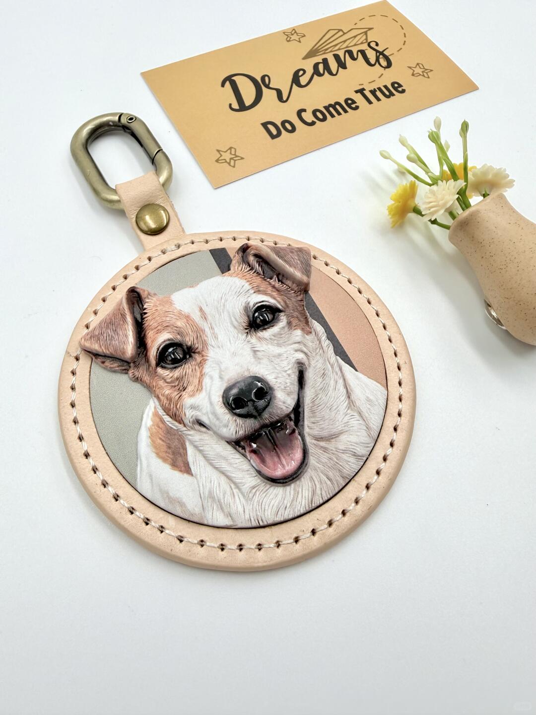 Close-up of a custom pet keepsake showing leather and metal hardware